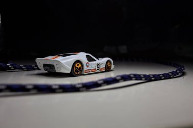 Mantova, Italy - 10TH AUGUST 2025 - Hot Wheels replica of a 1967 Ford GT40 MK IV pretending to make a curve during a race on a circuit