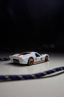 Mantova, Italy - 10TH AUGUST 2025 - Hot Wheels replica of a 1967 Ford GT40 MK IV pretending to make a curve during a race on a circuit