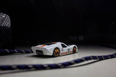 Mantova, Italy - 10TH AUGUST 2025 - Hot Wheels replica of a 1967 Ford GT40 MK IV pretending to make a curve during a race on a circuit
