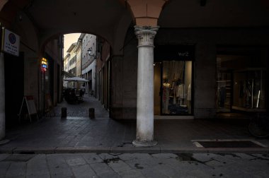 Mantova, Italy - 21ST AUGUST 2025 - Street and porch with the entrance of an alley in an opening of the building