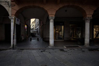 Mantova, Italy - 21ST AUGUST 2025 - Street and porch with the entrance of an alley in an opening of the building