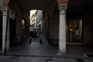 Mantova, Italy - 21ST AUGUST 2025 - Street and porch with the entrance of an alley in an opening of the building