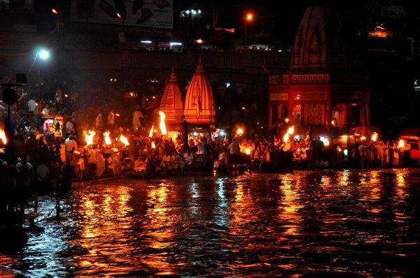 Evening prayers being offered by priests and worshiper at the banks of the holy river Ganga in Haridwar,India.