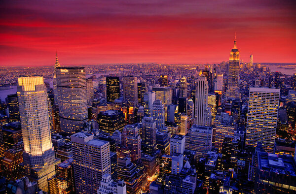 View of new york city with skyscrapers at sunset