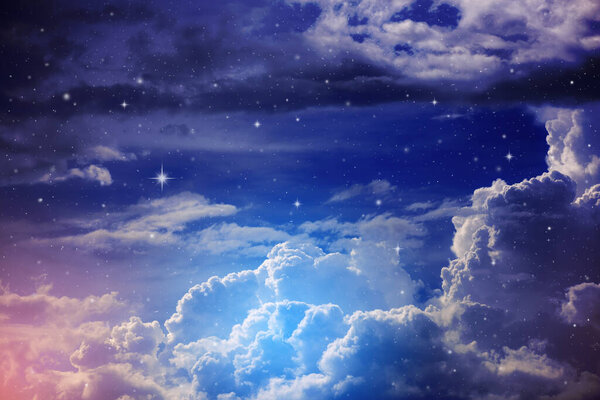 Colorful night sky with cloud and stars, light blue tone