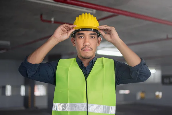 Construction worker at building site. Portrait of contruction worker.