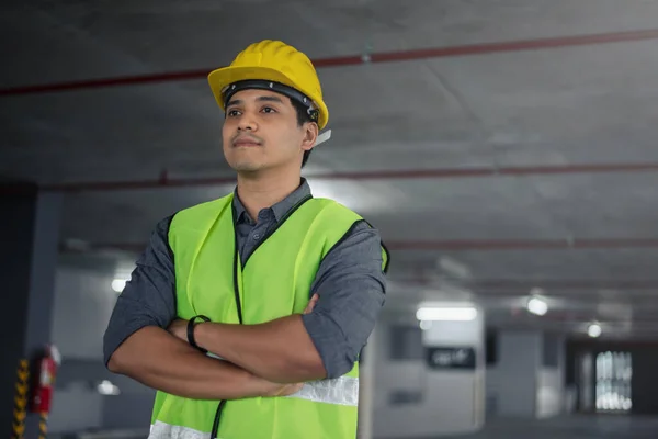 Construction worker at building site. Portrait of contruction worker.