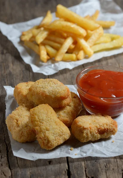 Chicken nuggets and french fries — Stock Photo, Image