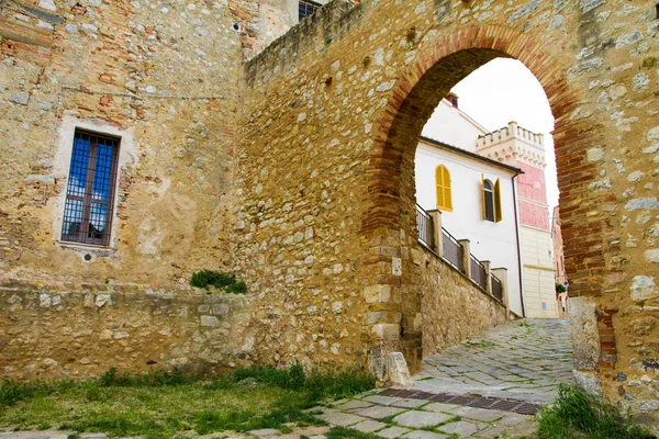 St. Martin gate in the old town of Magliano in Toscana, Italy