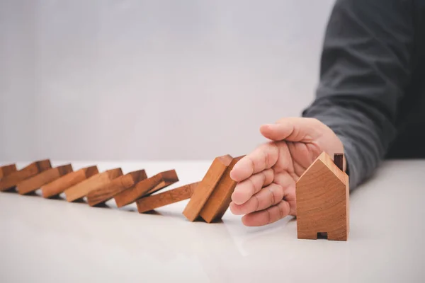 Business Man Hand Prevent Falling Wooden Stick Dominoes House Model — Stock Photo, Image