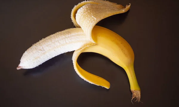 yellow banana with open skin