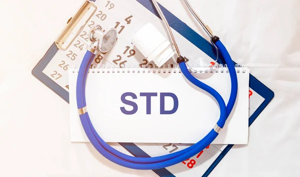 word STD on paper in doctor hands. Medical concept. doctor