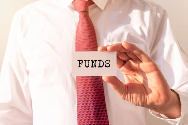 Fundos Palavra Sobre Papel Segurando Por Homem Negócios Conceito Financeiro — Fotografia de Stock