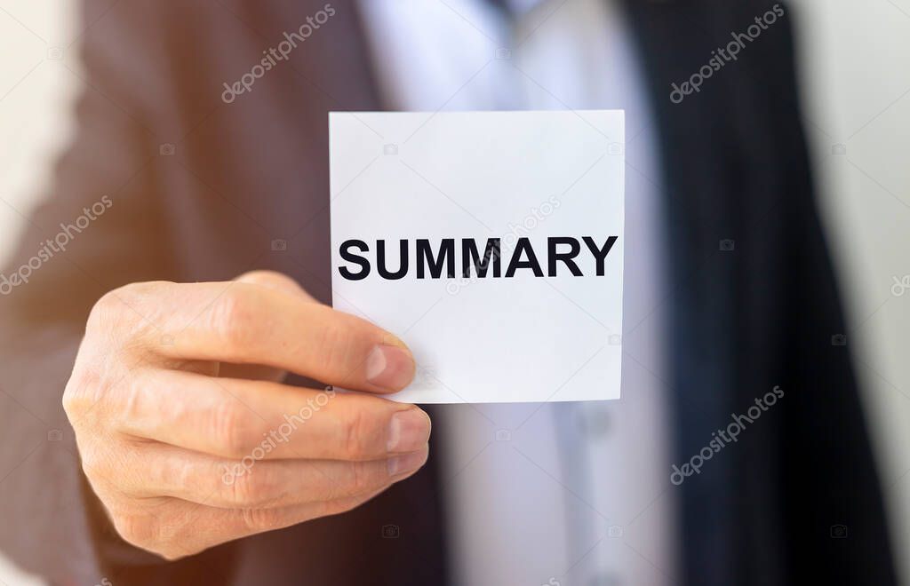 Summary word inscription, recap concept on paper card on office table