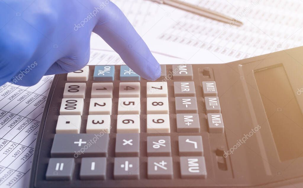 Accountant In Gloves Calculating Money Budget During Coronavirus Pandemic, close up