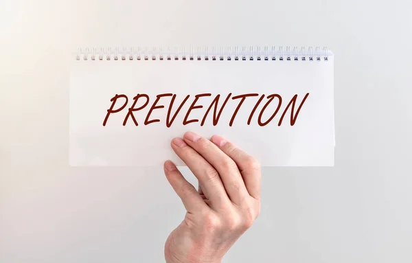 Prevention Word White Paper Male Hand White Wall — Stock Photo, Image