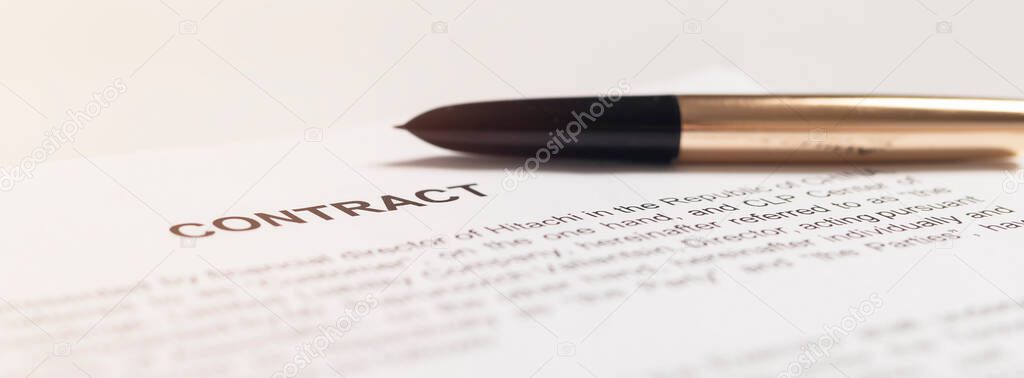 golden pen on the contract papers close up, banner.