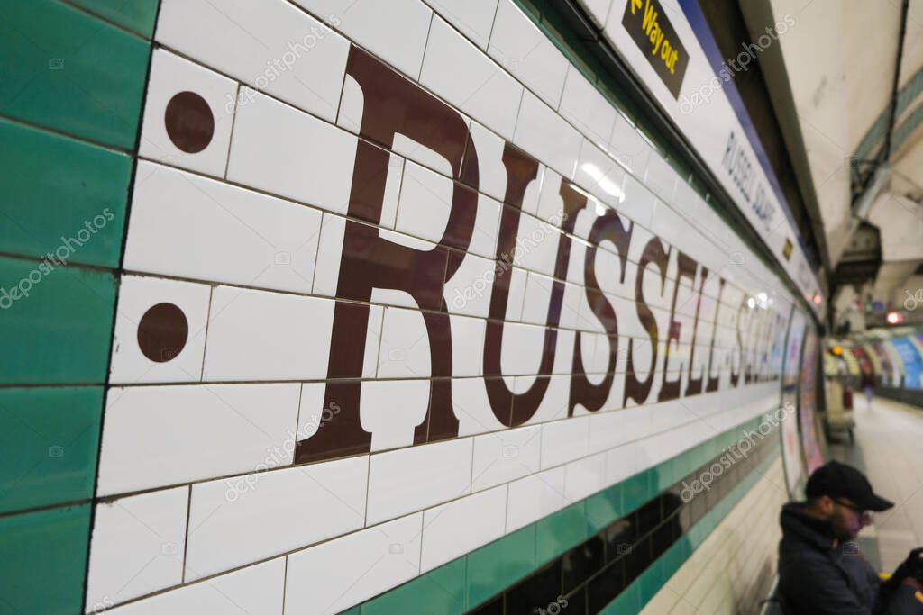 London, UK - March 1, 2020: Russell Square written on the tiles of a wall on a Russell Square tube platform in London, UK