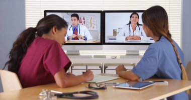 Group of diverse medical doctors video conferencing clipart