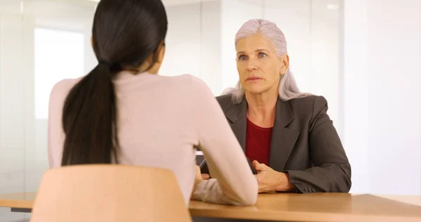 Two buisnesswomen have a meeting in the conference room