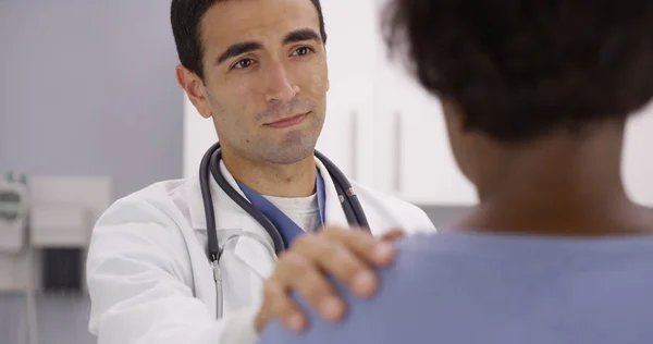 Lovely Male Latino Doctor Placing Hand Patients Shoulder Comforting Her — Stock Photo, Image