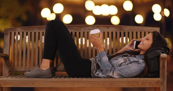 Millennial Female Chatting Cell Phone While Lying Bench City Street — Stock Photo, Image