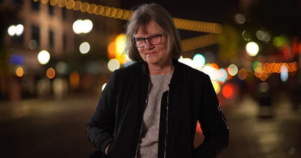 Somber Old Lady Hands Pockets Looking Camera Standing City Street — Stock Photo, Image