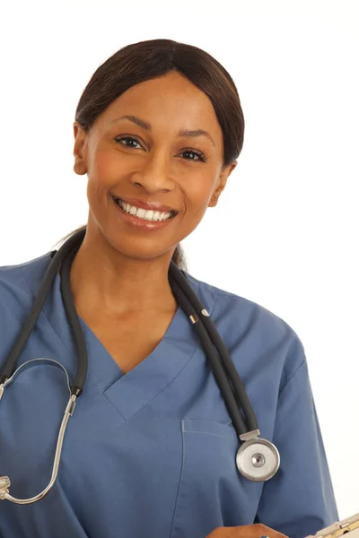 Close up of smiling black doctor wearing scrubs on white background