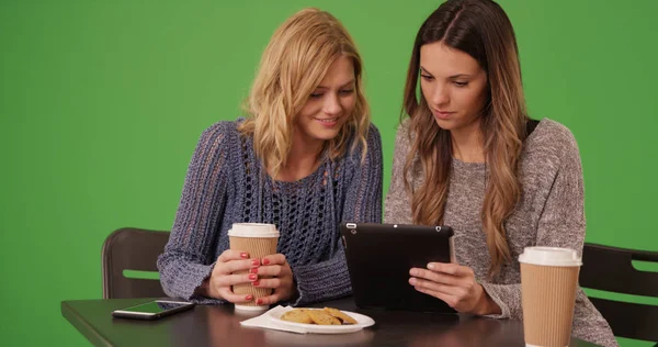 Lovely Couple Girls Sitting Sharing Tablet Computer Green Screen — Stock Photo, Image