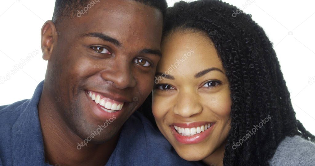 Young black couple in love leaning head against each other