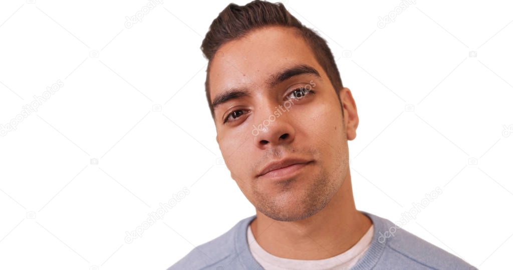 Wide angle close up portrait of Hispanic millennial with copyspace on white background