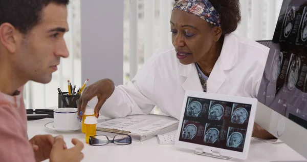 Middle Aged Black Doctor Talking Patient Scans Medication — Stock Photo, Image