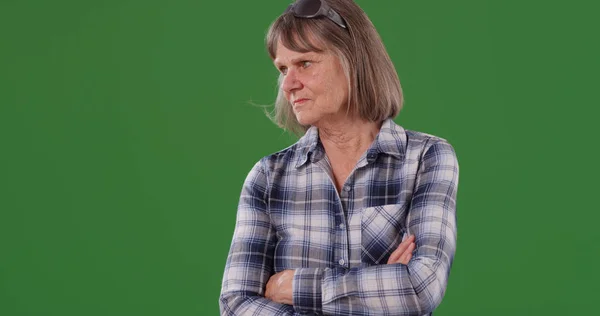 Serious White Senior Woman Crossing Arms Standing Green Screen — Stock Photo, Image