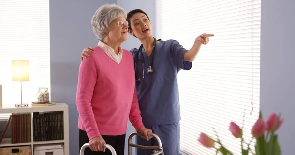 Chinese Nurse Elderly Woman Patient Looking Out Window — Stock Photo, Image