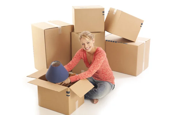 Young Woman Unpacking Cardboard Boxes — Stock Photo, Image