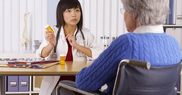 Asian Doctor Explaining Prescription Elderly Patient — Stock Photo, Image