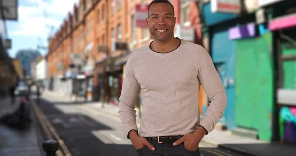 Bold Young African American Man Poses Confidently Urban Setting — Stock Photo, Image