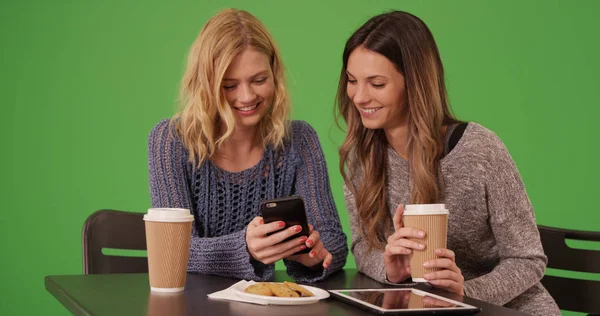 Couple Cute Girls Drinking Together Looking Cell Phone Green Screen — Stock Photo, Image