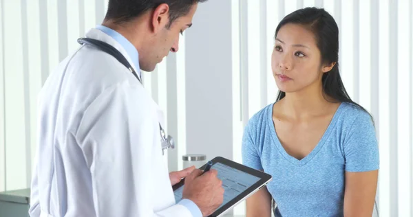 Hispanic Doctor Asking Asian Patient Questions — Stock Photo, Image