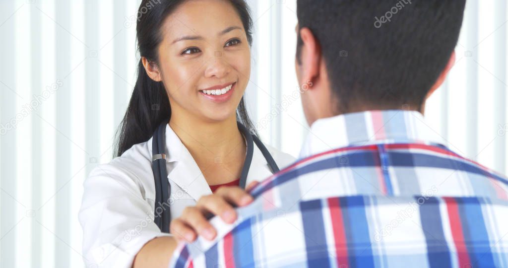 Chinese doctor telling patient the good news