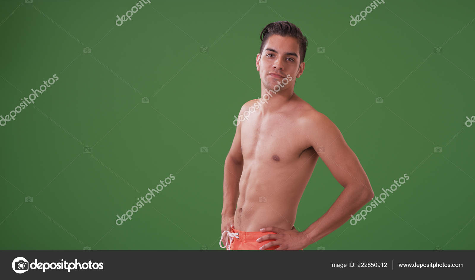 Handsome Hispanic Man Swim Trunks Posing Green Screen — Stock Photo ©  mark@rocketclips.com #222850912