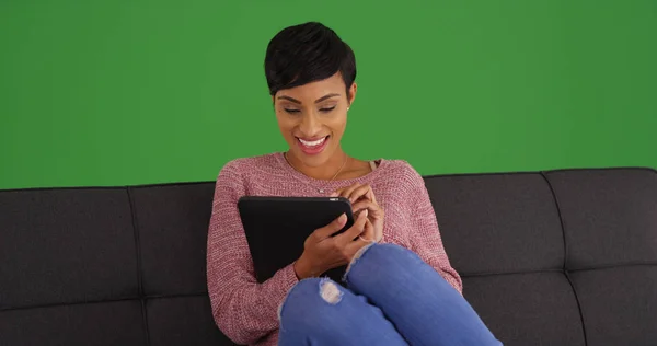 Young Happy Black Female Using Tablet Sitting Couch Green Screen — Stock Photo, Image