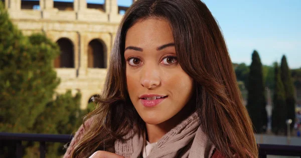 Close up portrait of beautiful Latina woman smiling in Rome