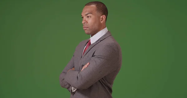 Black Businessman Looks Out Confidently Green Screen — Stock Photo, Image