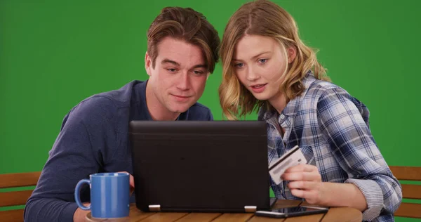 Young Couple Making Online Payments Credit Card Laptop Green Screen — Stock Photo, Image
