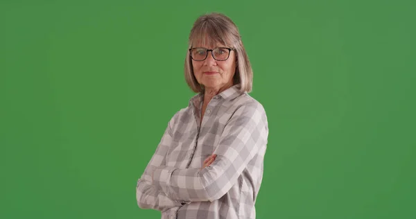 Confident Senior Woman Arms Crossed Standing Green Screen — Stock Photo, Image