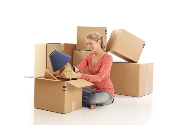 Young Woman Unpacking Cardboard Boxes — Stock Photo, Image