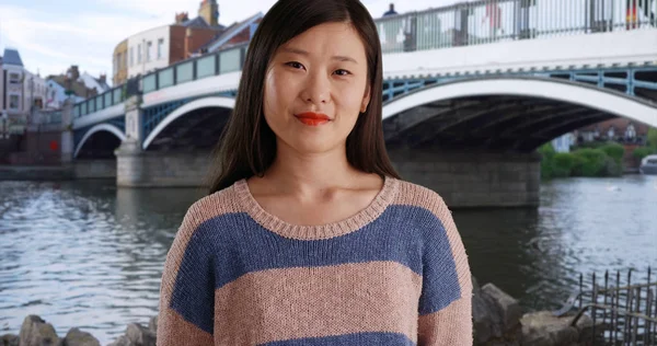 Close up of pleasant millennial woman wearing a sweater in Windsor UK