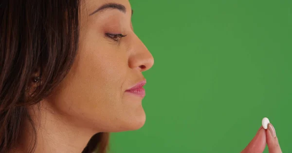 Close Young Latina Woman Taking Pill Drinking Water Green Screen — Stock Photo, Image