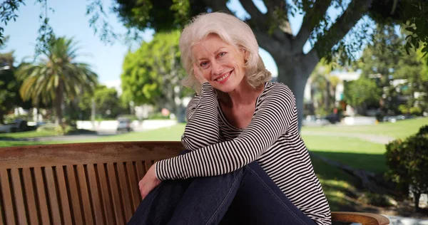 Cheerful Female Senior Posing Happily Park Bench Sunny Day — Stock Photo, Image